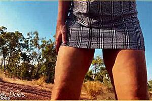 Milf wife flashes shaved pussy in upskirt voyeur scene.