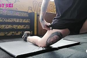 Alternative girl stretching at the gym