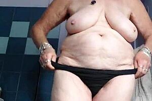 blonde granny fucks her old hairy pussy with a big cucumber!