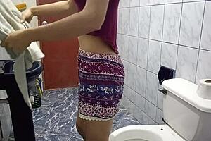 Pretty latina with small tits gets spied on in bathroom, pulls out cock, and fucks tight pussy