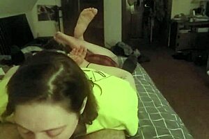 she lays on her stomach, deepthroating like a submissive slut