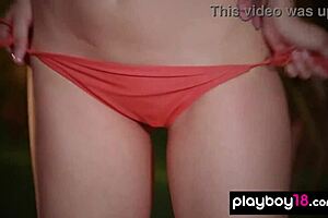 Inked teen Elizabeth Marxs showing her massive tits in a tropical forest!