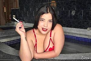 Smoking in the jacuzzi while you worship my tits and ass