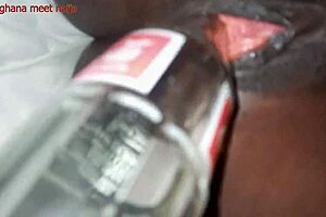 Playing with ebony pussy and fucking it with coka cola bottle