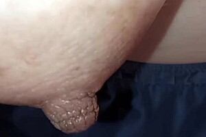 intriguing close-up of nipple on piano keys in detailed view