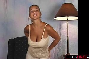 model dancing in beige dress with bouncing chest and jumping tits
