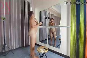 Naked nudist hairdresser stylist cuts her own hair regina noir