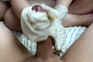 Masturbates Cock in Latex Gloves