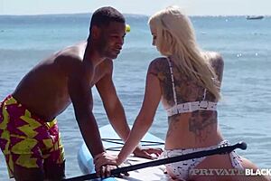 Hot blonde Marica Chanelle takes big black cock deep in her ass, moaning passionately.