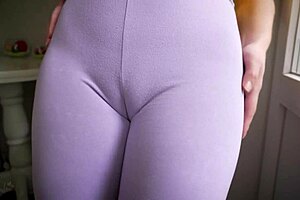 in the gym, a girl in tight leggings shows off