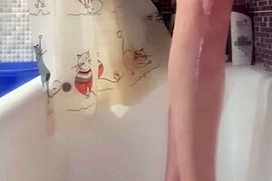 Why is that busty babe washing her feet in the shower?