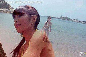 skinny japanese chick enjoys having a photoshoot on the beach