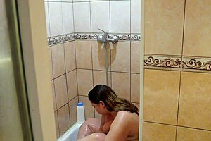 home cam watches a chubby milf in the shower beautiful bbw washes and shaves behind the scenes