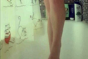 Why is that busty babe washing her feet in the shower?