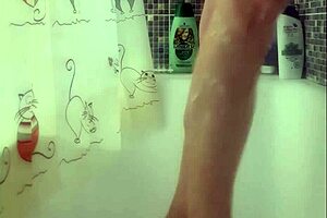 Why is that busty babe washing her feet in the shower?