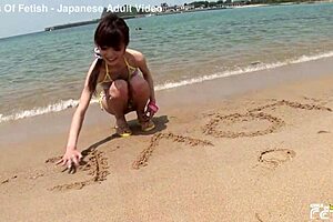 skinny japanese chick enjoys having a photoshoot on the beach