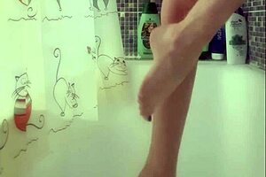 Why is that busty babe washing her feet in the shower?