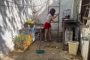 cleaning the patio in skirt reveals irresistible view