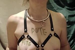 In a homemade session, the female slave in harness endures bondage and masturbation with dirty talk.