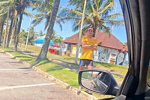 woman masturbates discreetly in public street