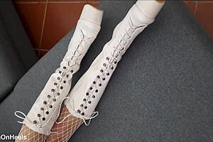 perfect-assed milf wears high-heeled boots and fishnet stockings