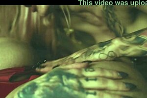 two tattooed girls having fun with toys