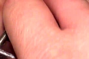 Fist Queen Endures Intense Pussy Stretching with Metal Ring in Extreme Session