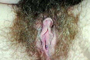 Hairy pussy close-up: quick bed masturbation builds to big clit orgasm and intense cumming