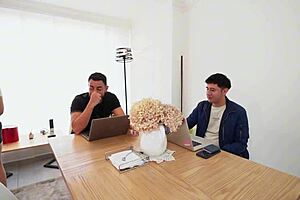 Employee interacts with two students in a professional setting