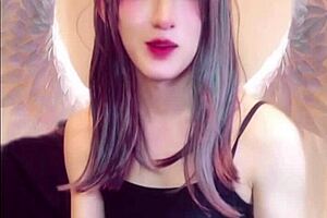 Cute Japanese Shemale Masturbates While Streaming