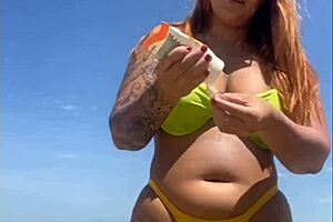 African woman flashes big pussy on beach