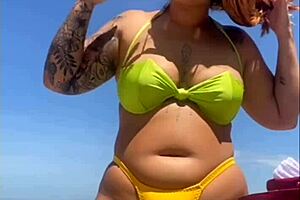 African woman flashes big pussy on beach