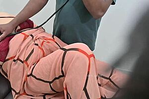 Indian Doctor Thoroughly Checking Lady Patient In Clinic