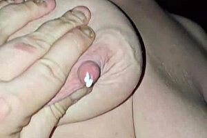 hey, check out this milf milking her big tits while riding that cock