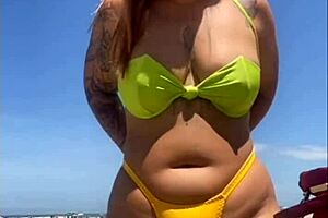 African woman flashes big pussy on beach