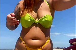 African woman flashes big pussy on beach