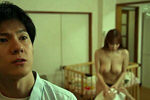 Young mother breastfeeding daily in emotional family moment