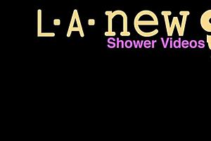 Shy blonde teen enjoying a relaxing shower after photoshoot