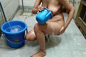 Indian bhabhi bathes openly while in-law watches her touch tight pussy