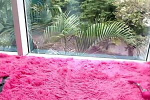 a german teen with small tits plays in the window on cam