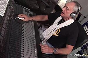 busty brunette chick gets fucked by two music producers on the sofa