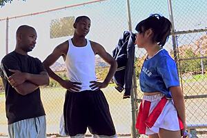 Asian Slut Sucks Two Black Cocks