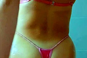 Tanned Latina beauties rinse off beach sand in steamy shower