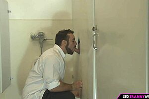 shemale tempts throbbing cocks through gloryhole