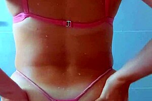 Tanned Latina beauties rinse off beach sand in steamy shower