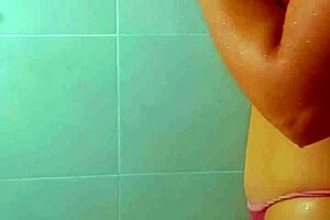 Tanned Latina beauties rinse off beach sand in steamy shower