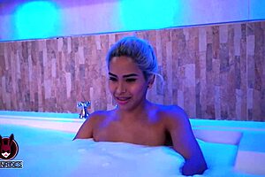 Blonde lesbian dives into partner's pussy in steamy bathroom bath