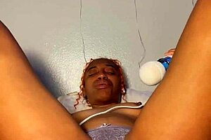 ebony beauty stuffs panties deep in her tight wet pussy for explosive orgasm