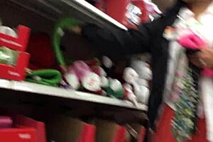 A candid mom browses shops unaware in hidden footage