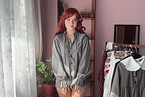 Skinny redhead nerd in stockings poses solo library style